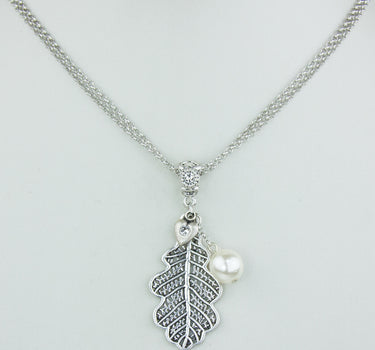 LUISIA Silberne Doppelhalskette mit Eichblatt und Kristallen von Swarovski